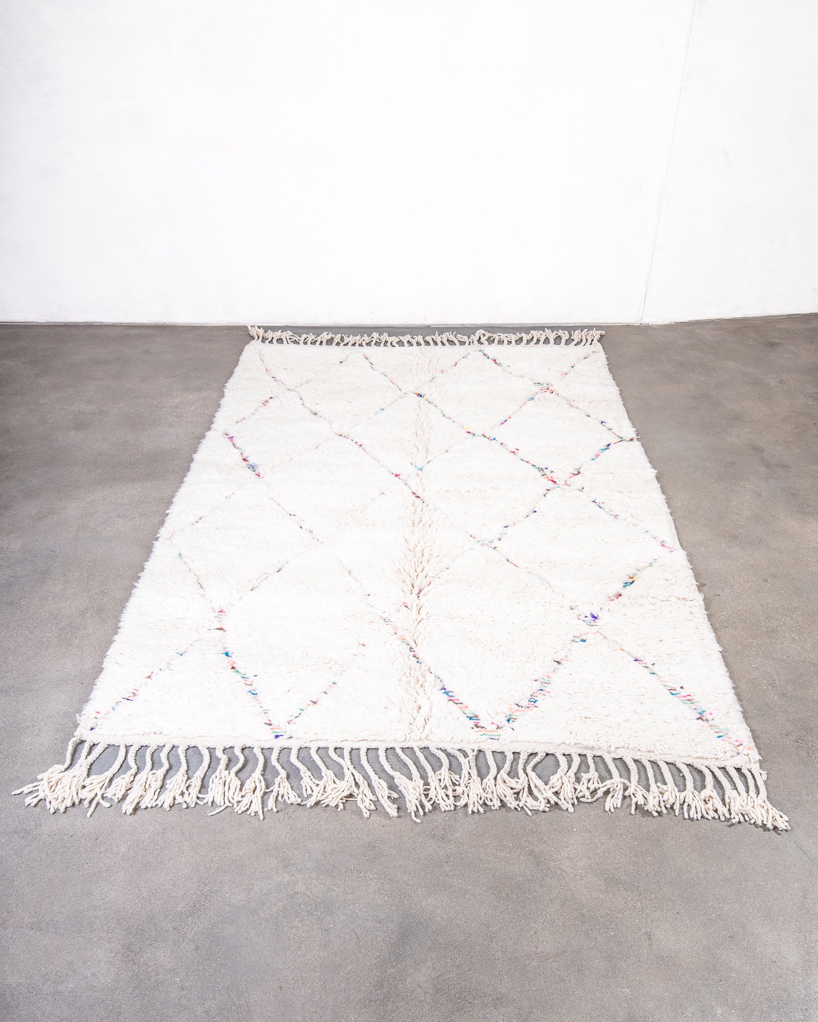 Modern, designer, handcrafted Berber rug from Morocco. Beniourain carpet with beautiful colours and patterns and fluffy wool texture.